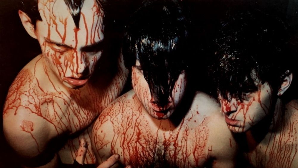 Cover art from Samhain's Initium with three men covered in blood