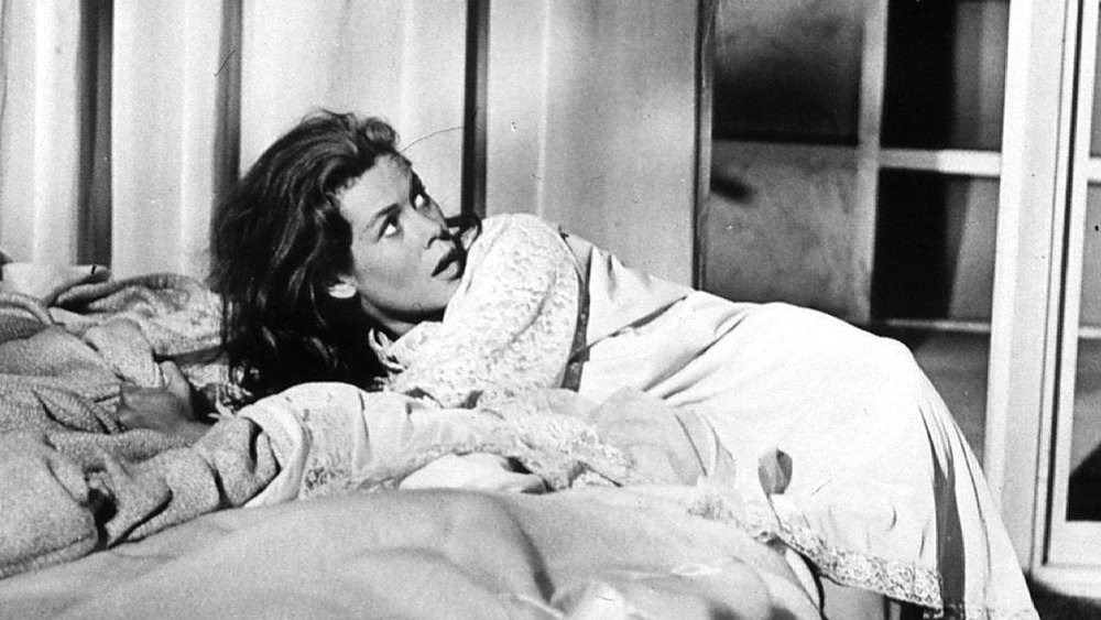 Elizabeth Montgomery laying on bed