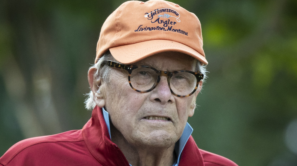 Tom Brokaw wearing a hat