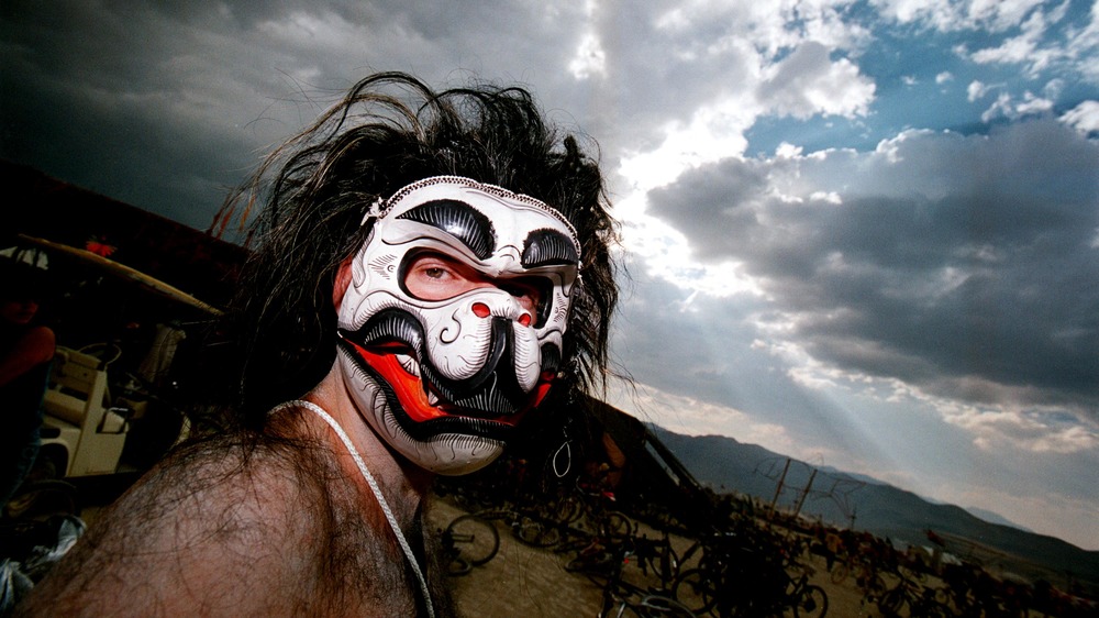 man wearing animal mask