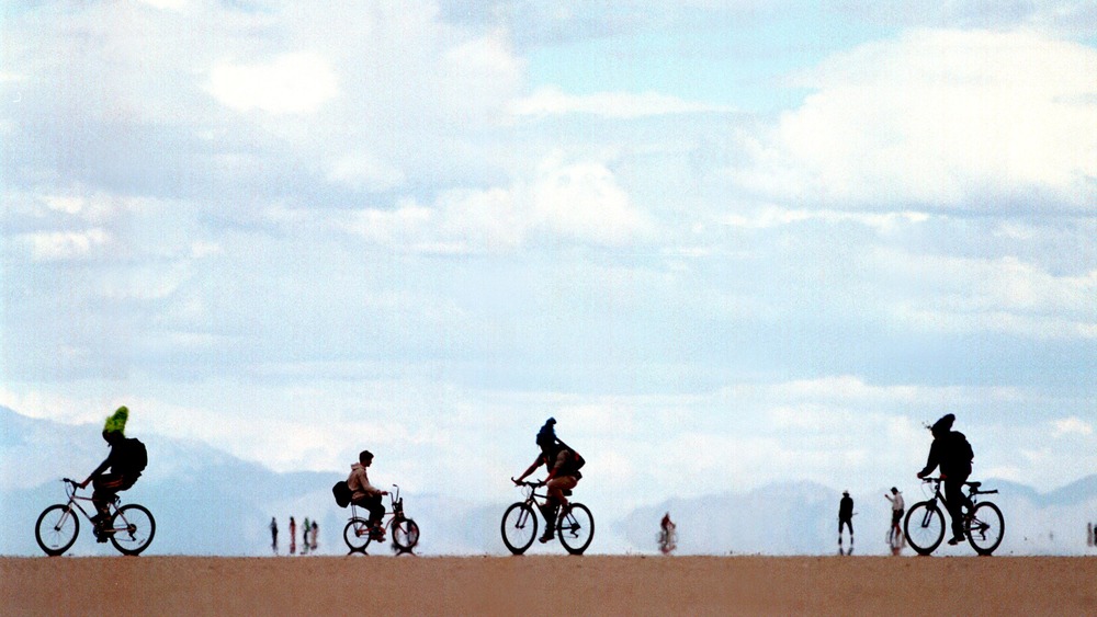 Festival-goers on bicycles 