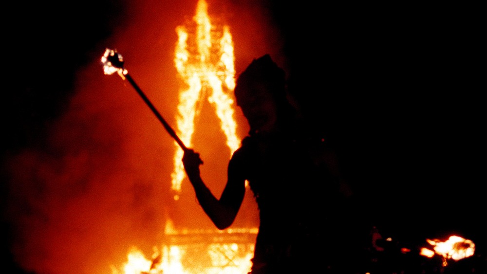 a festival-goer with a fire stick