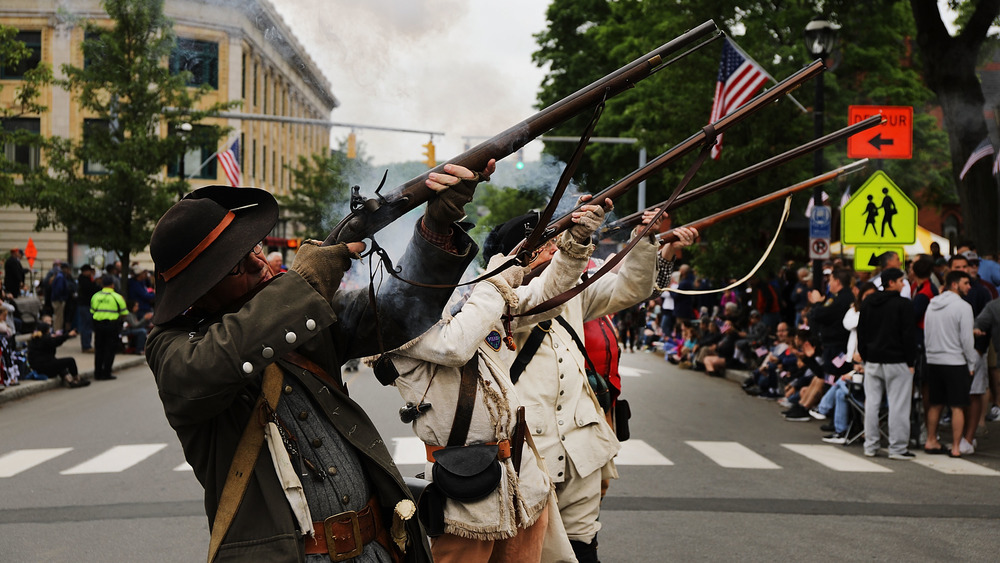 American Revolution reenactors holding rifles