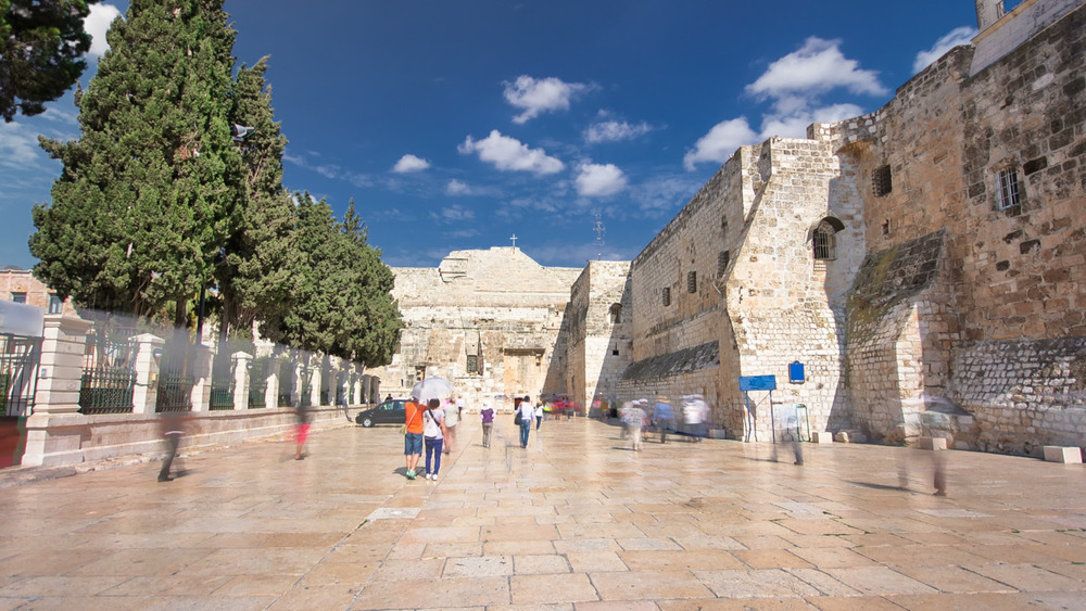 Church of the Nativity with people walking 