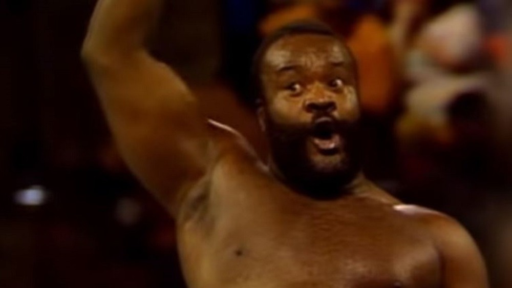 Junkyard Dog raising his hand