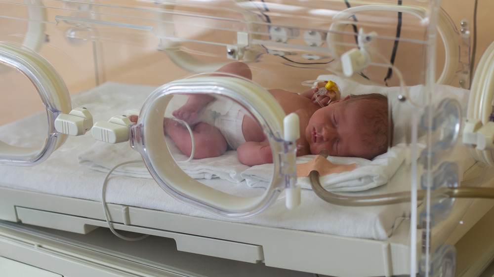 Baby in a hospital incubator