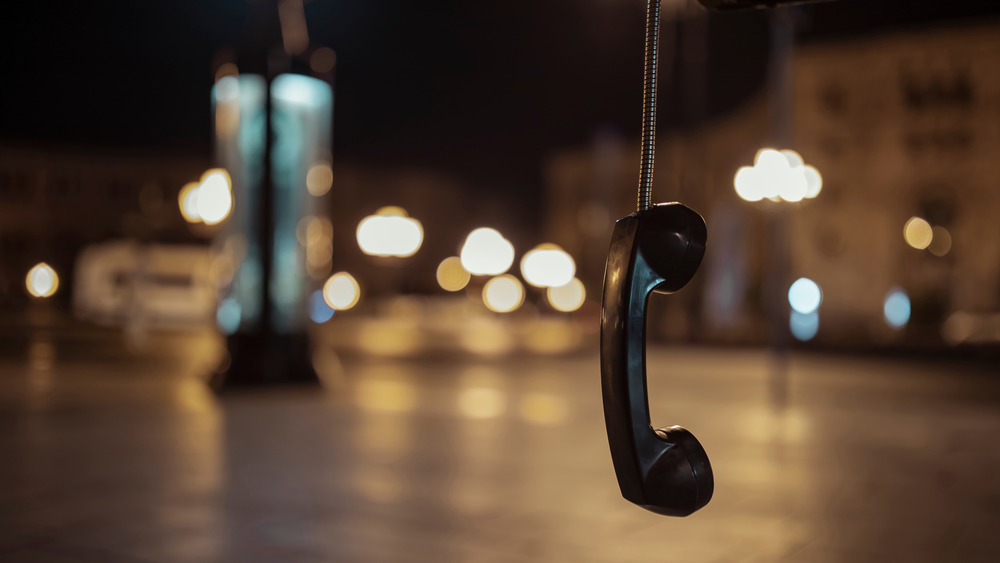 A payphone hanging