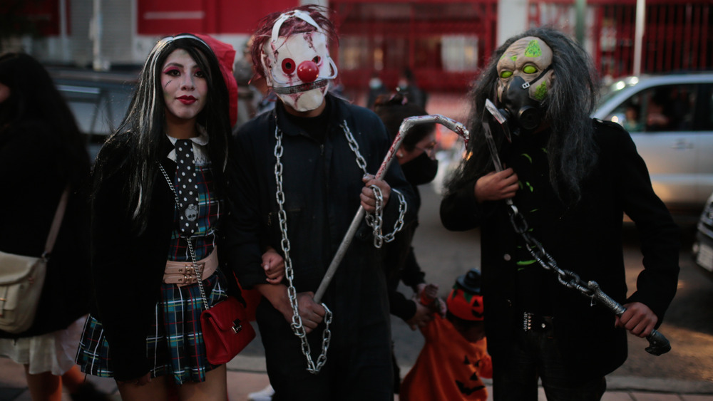 People dressed in horror costumes 