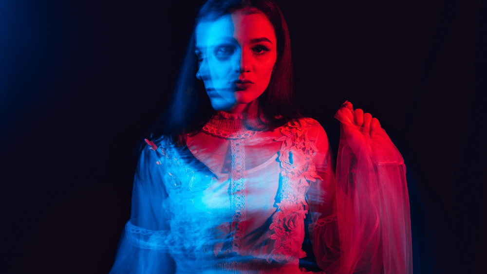 Blurred image of paranoid woman