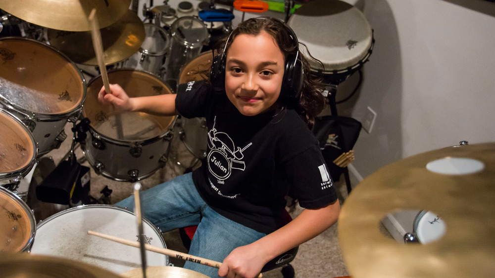 Julian Pavone sitting at his drums