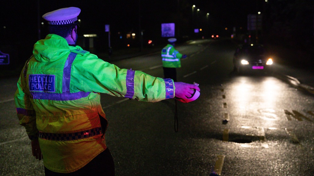 A traffic cop checking for traffic violators