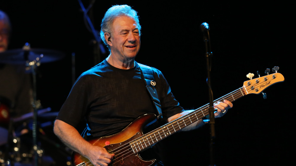 Stu Cook onstage with bass, 2019