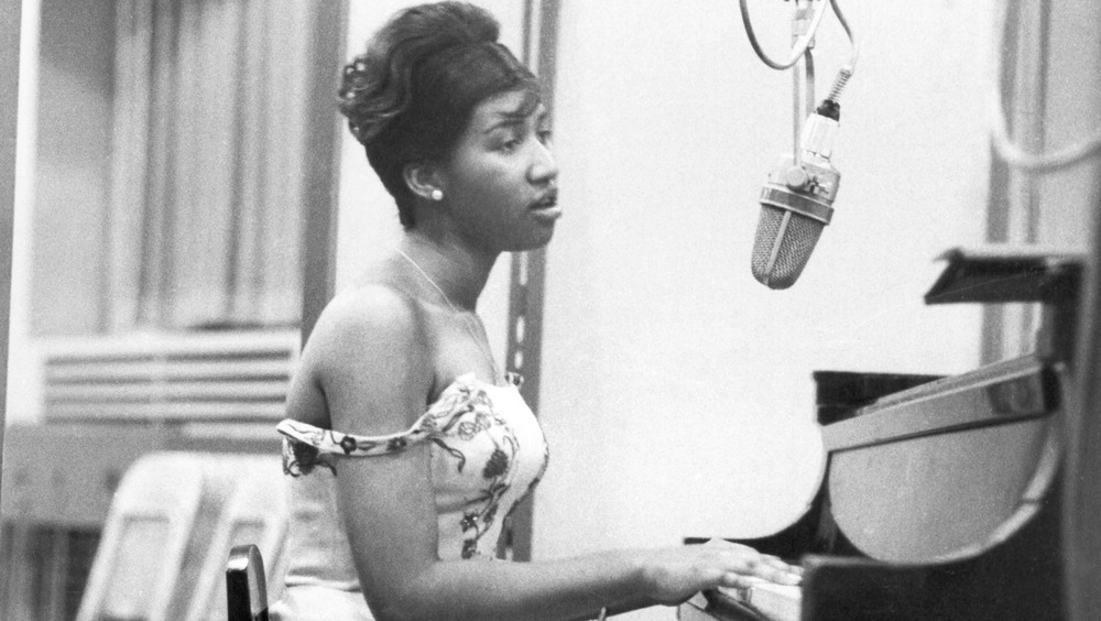Aretha Franklin playing piano