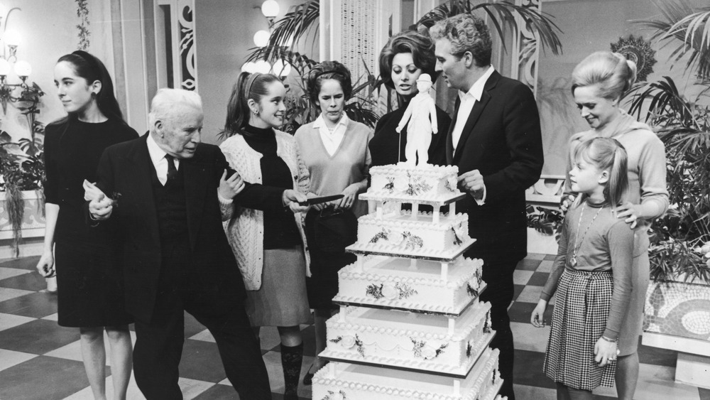 Tippi Hedren and guests with cake at Charlie Chaplin's birthday party