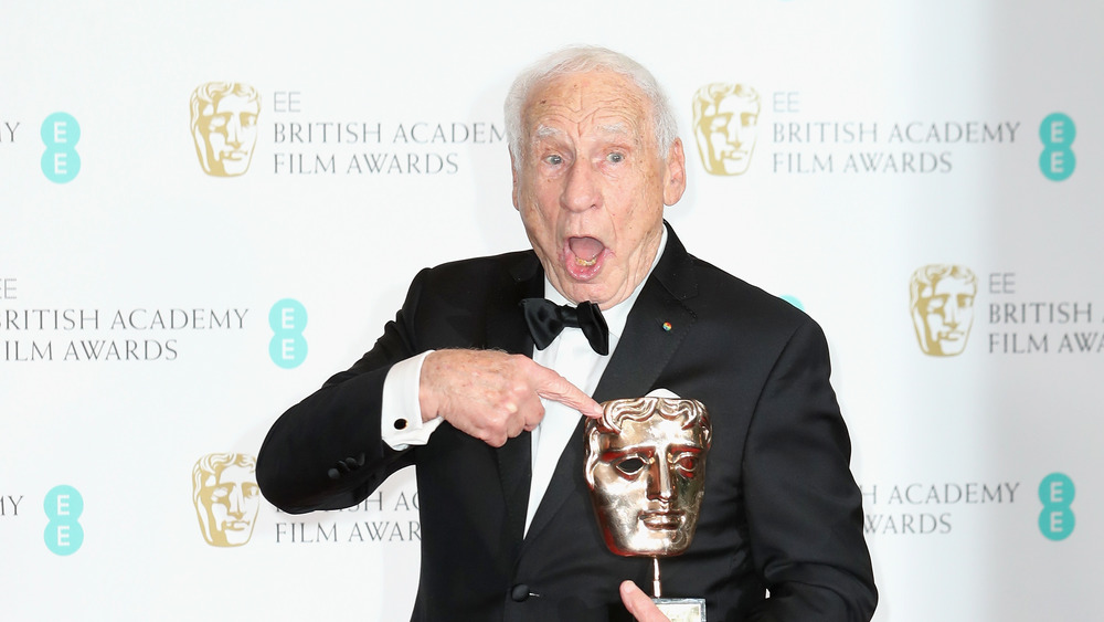 Mel Brooks holding a BAFTA