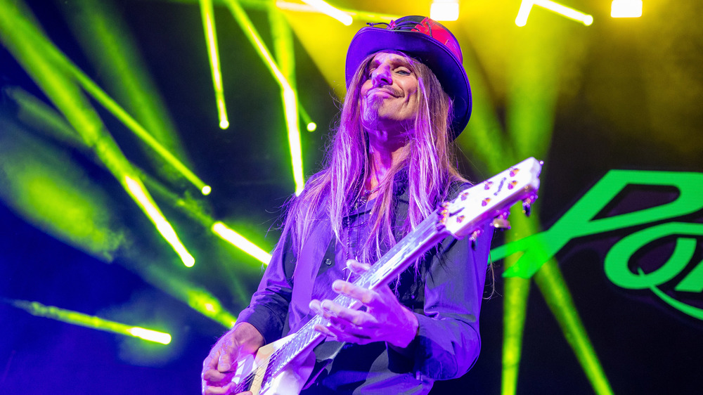 CC DeVille of Poison plays the guitar during a 2018 show.