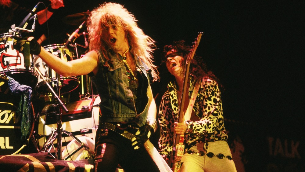 Bret Michaels and Bobby Dall of Poison perform during a 1987 concert.