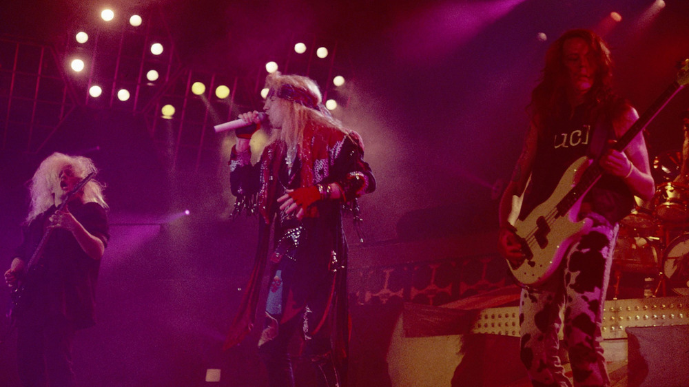 CC DeVille, Bret Michaels, and Bobby Dall of Poison (L-R) perform in Philadelphia in 1990.