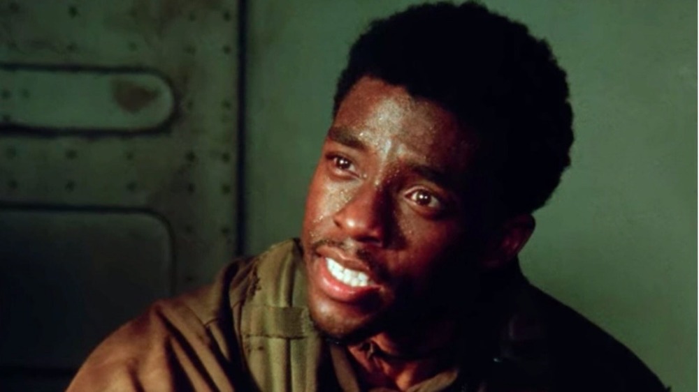 Chadwick Boseman looking sweaty and upset