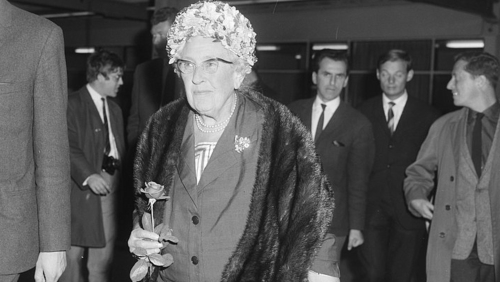 Agatha Christie wearing floral hat