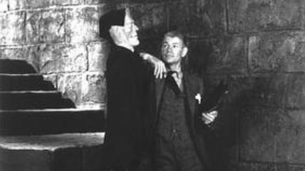 James Whale poses with a model of Frankenstein's Monster