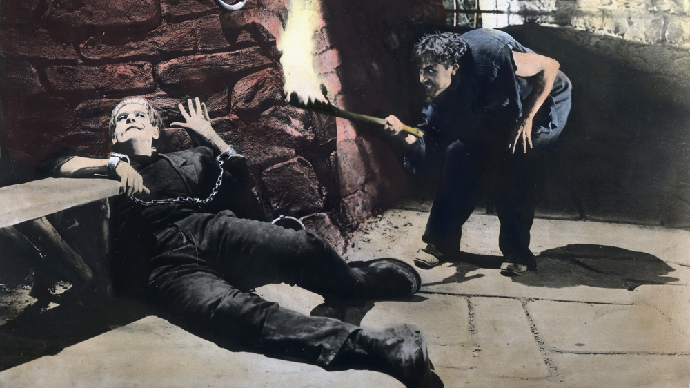 Fritz tortures the monster in 1931's Frankenstein