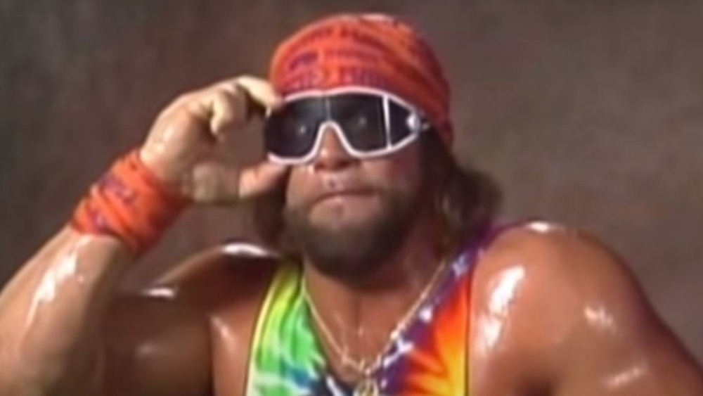 Randy Savage adjusting his sunglasses