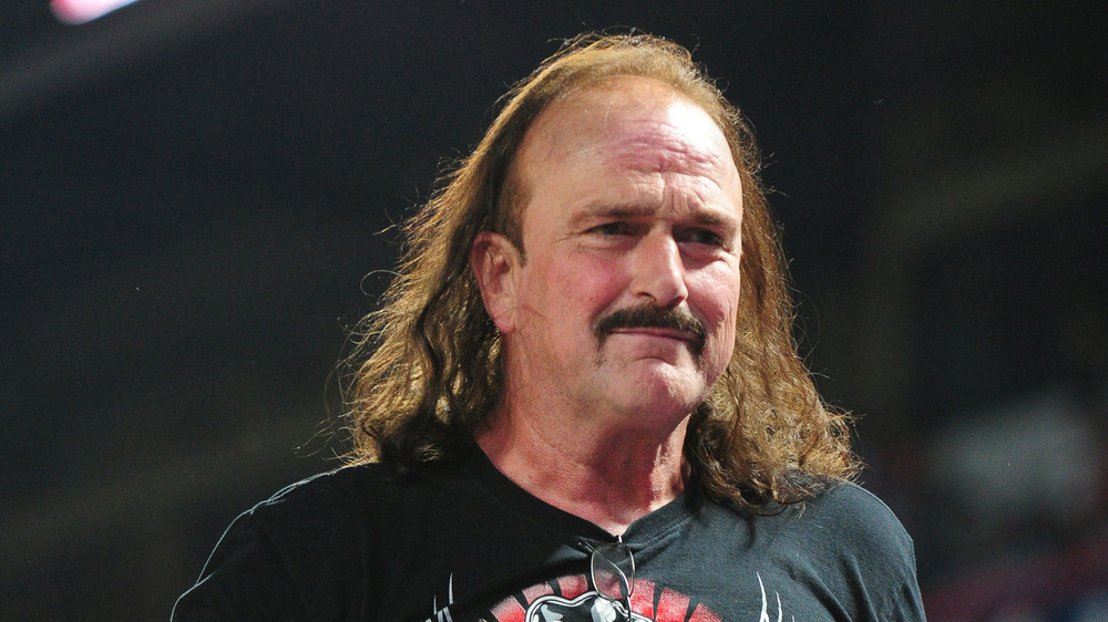Jake the Snake Roberts in a black shirt