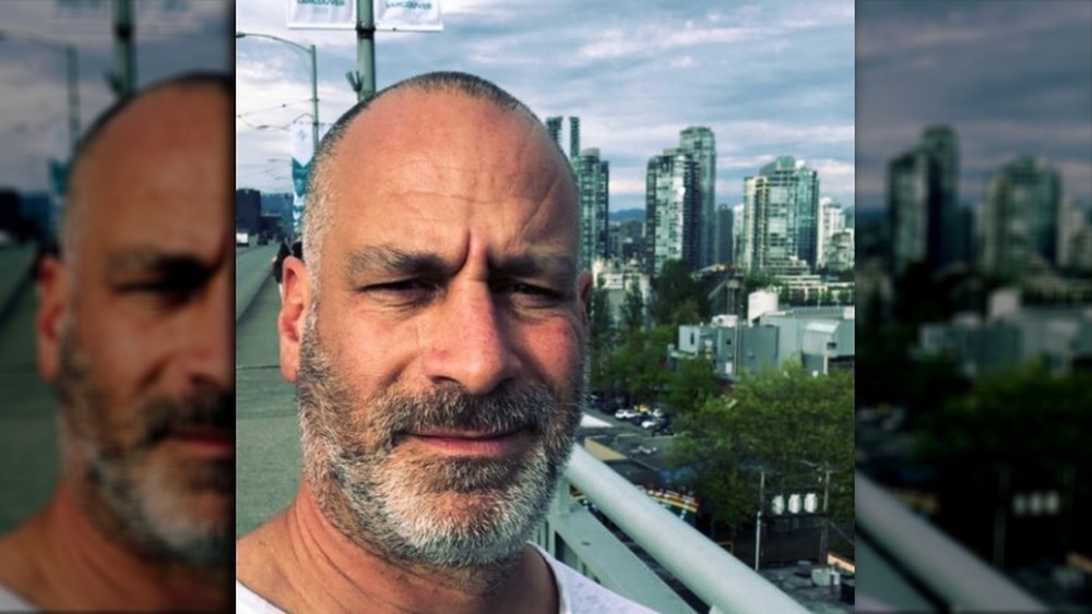 Adam Rugel selfie in front of skyscrapers