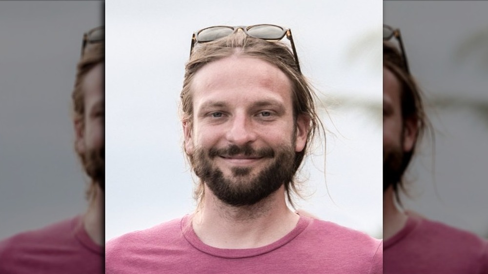 Blaine Cook headshot photo with glasses on head