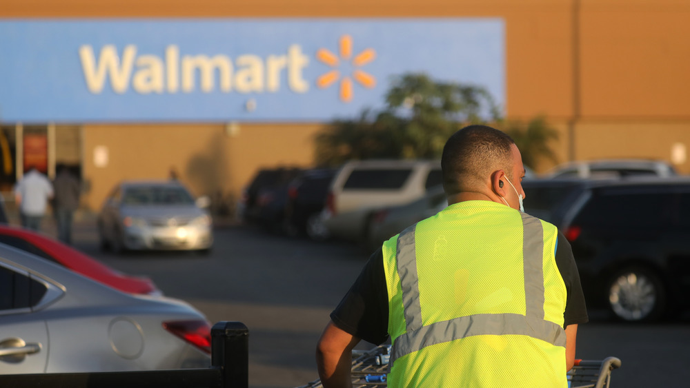 Walmart worker wearing neon yellow vest