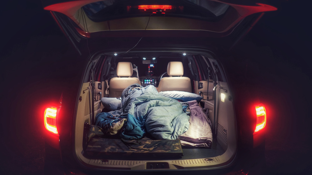 Car hatch filled with sleeping bags