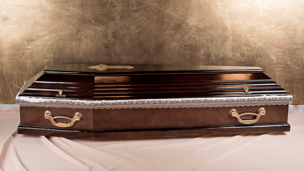 A coffin on a white sheet