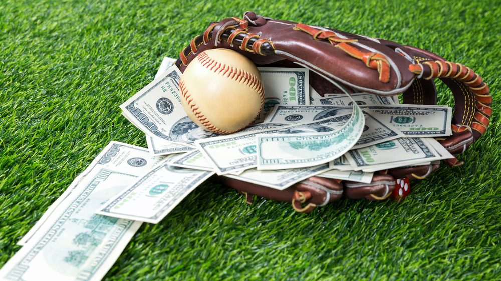 Money in baseball mitt