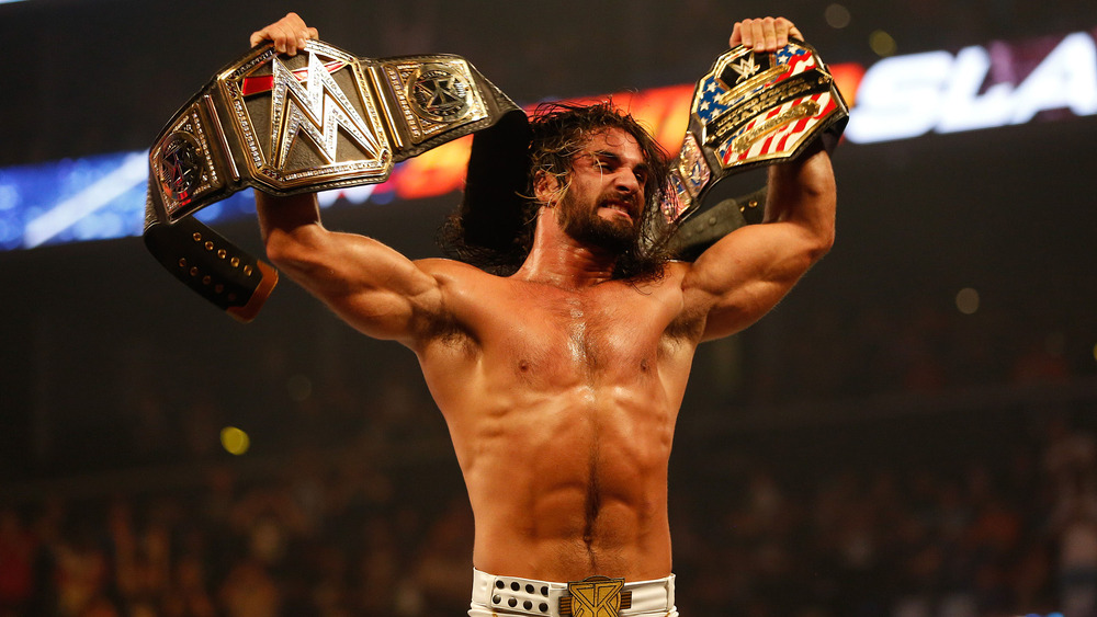 Seth Rollins with title belts