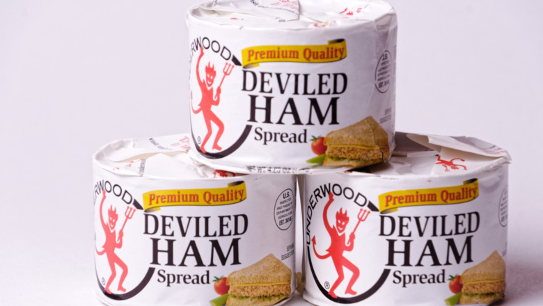 Three of Underwood's deviled ham cans