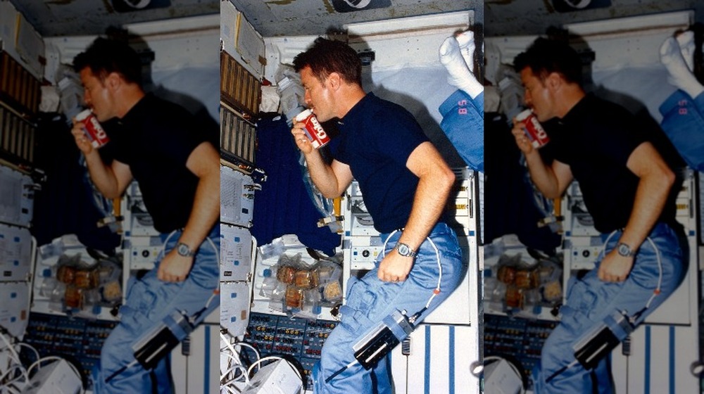 NASA astronaut tries out the Coca-Cola space can