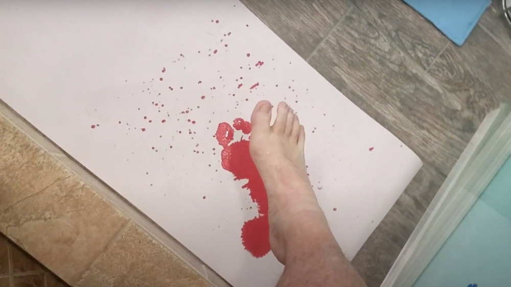 Bloody bath mat with footprints