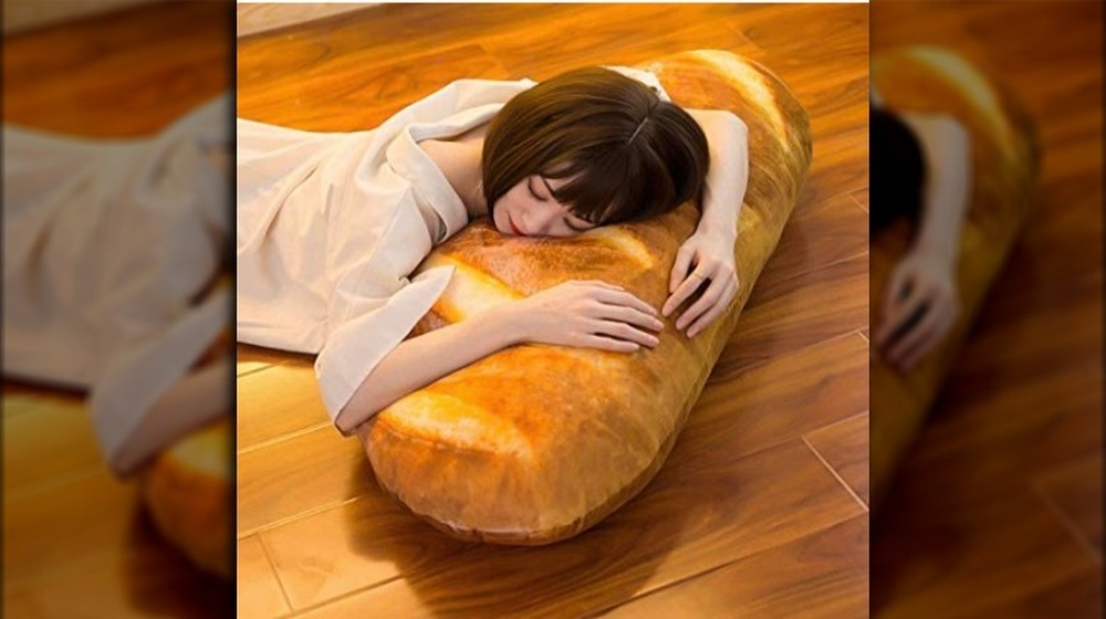 Woman relaxing on bread pillow
