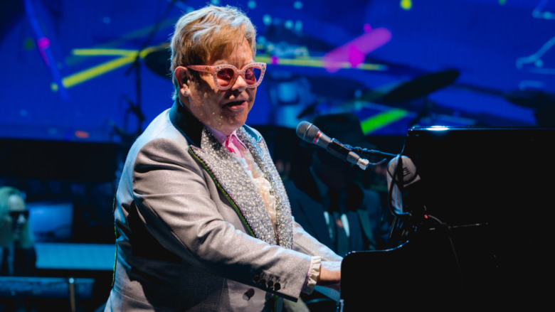 Elton John playing piano 
