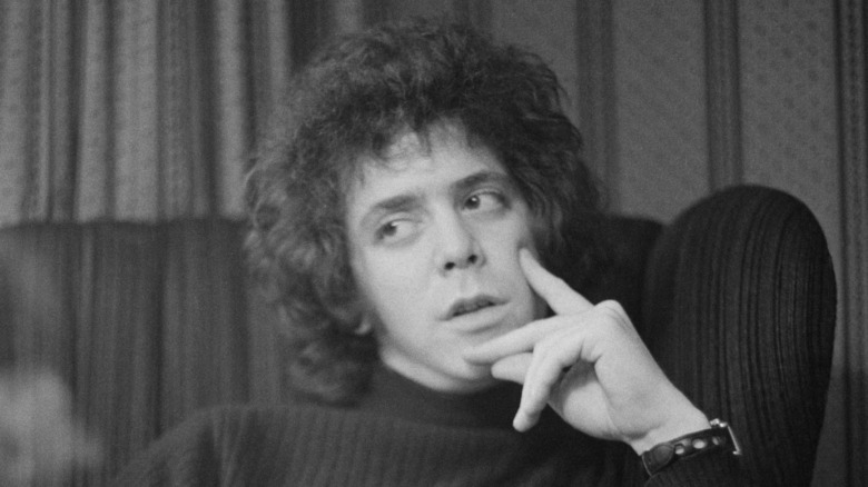 Lou Reed with hands on face