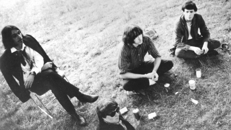 The Velvet Underground sitting on the ground
