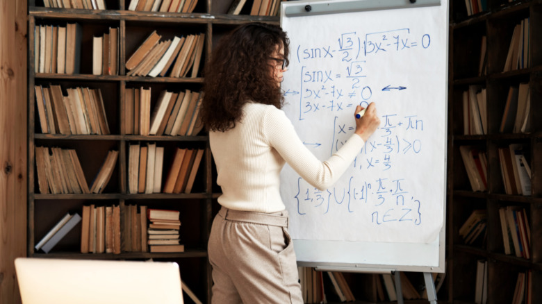 woman solving equation
