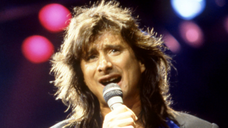 Steve Perry singing on stage 