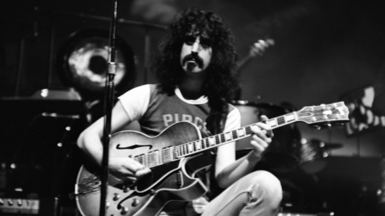 Frank Zappa playing guitar onstage