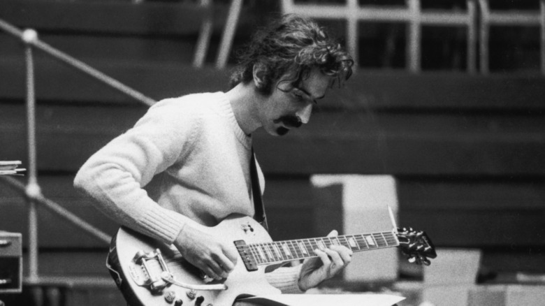 Frank Zappa playing the guitar