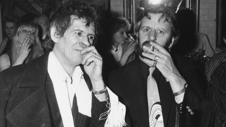 Keith Richards and Ringo Starr smoking at a birthday party at Crazy Larry's, circa 1985