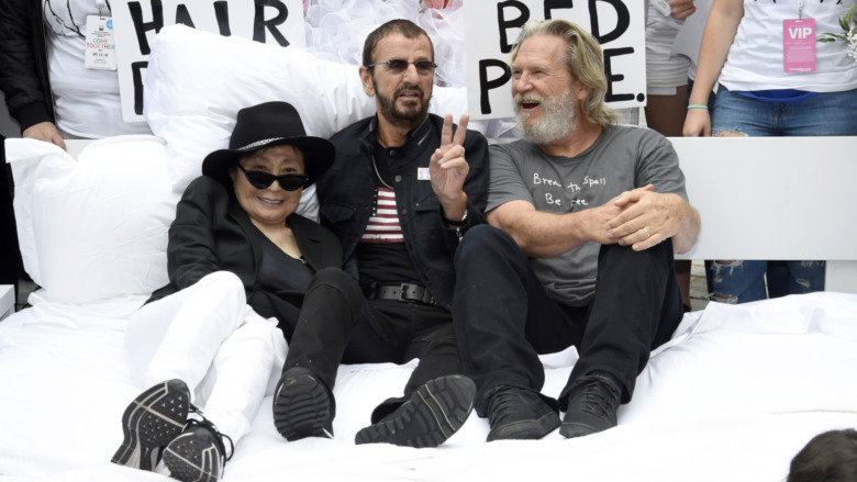 Yoko Ono, Ringo Starr, and Jeff Bridges in a bed