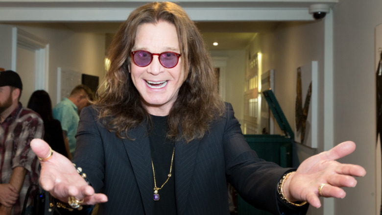Ozzy Osbourne in a welcoming pose