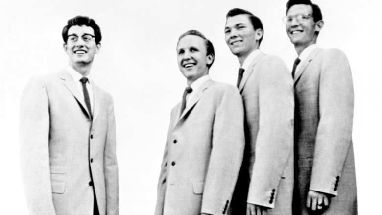 buddy holly smiling with his band